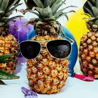 Partying pineapples wearing sunglasses
